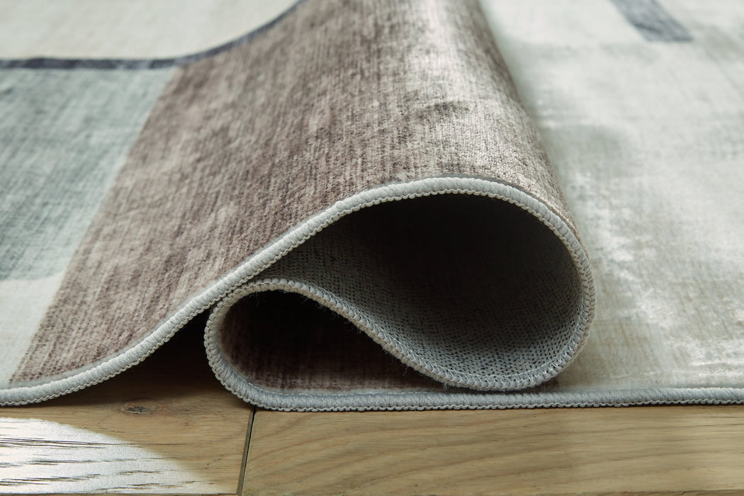 Larkport Washable Area Rug - Woo Town Furniture (Worcester,MA)