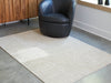 Wolbert 5' x 7' Area Rug - Woo Town Furniture (Worcester,MA)